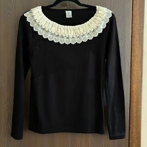 The Wizard of Oz black long sleeved sweater with lace and pearls at the neck. Sm